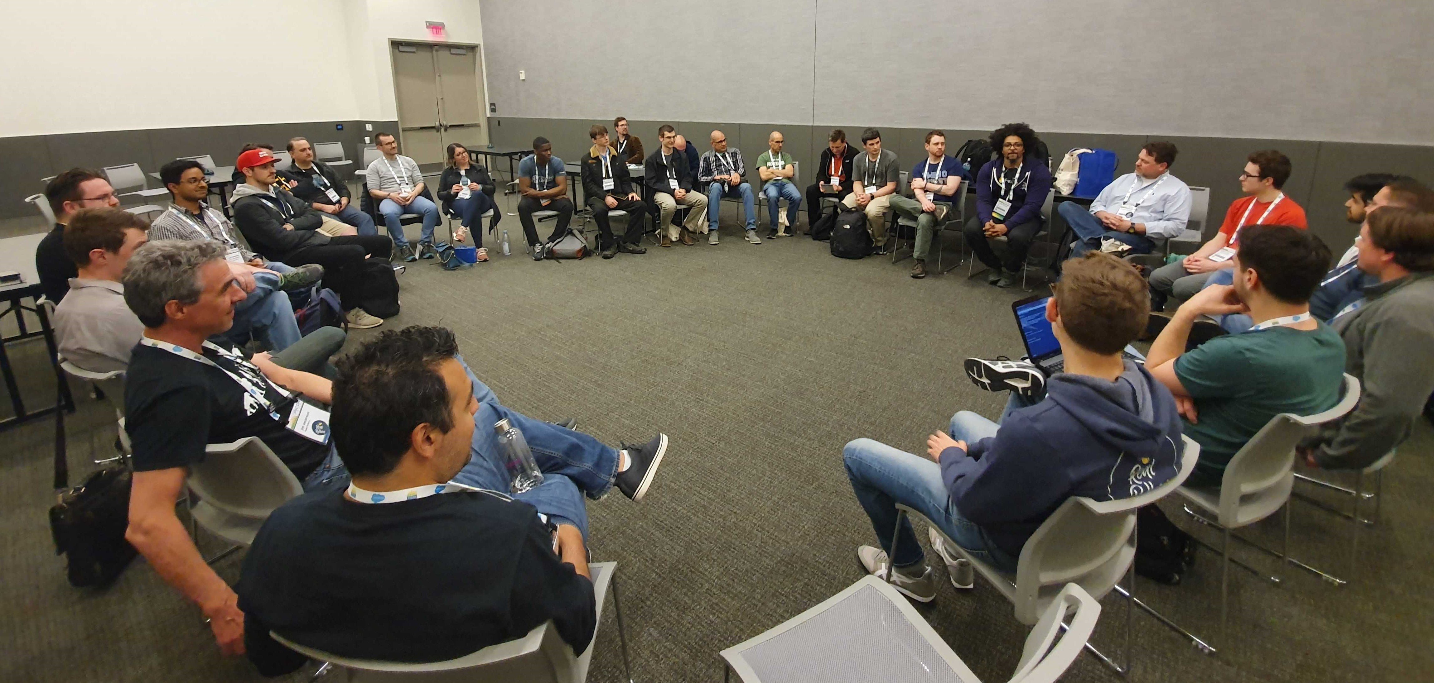 All attendees of the Real Python Open Space seated at PyCon